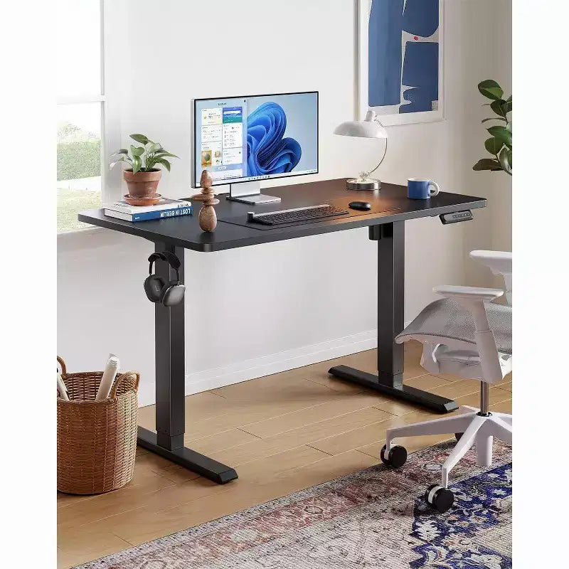 HUANUO 55x24 Electric Standing Desk, Adjustable Height, 4 Memory Settings, Headphone Hook for Home Office, Black